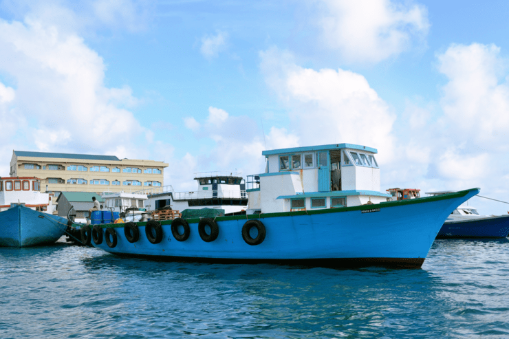 Blue fishing boat in tranquil waters