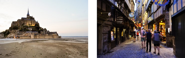 A islet monastery at low tide and people walking through a village street at night