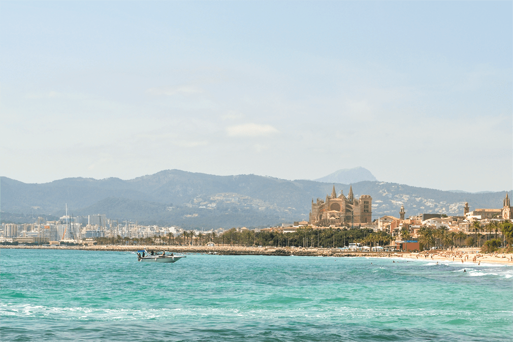 Beachside scene with towering cathedral
