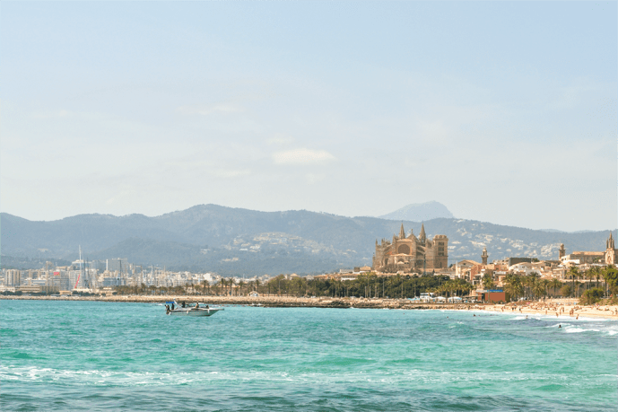 Beachside scene with towering cathedral