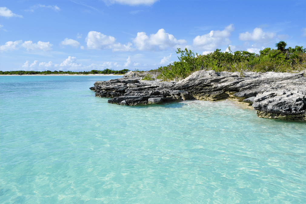 A rocky shoreline and crystalline waters
