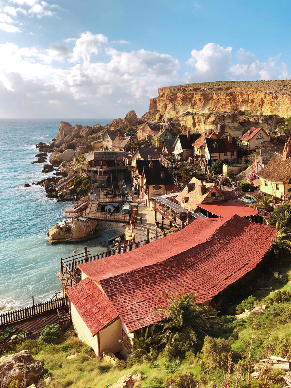 A colorful village built on the cliffs by the ocean