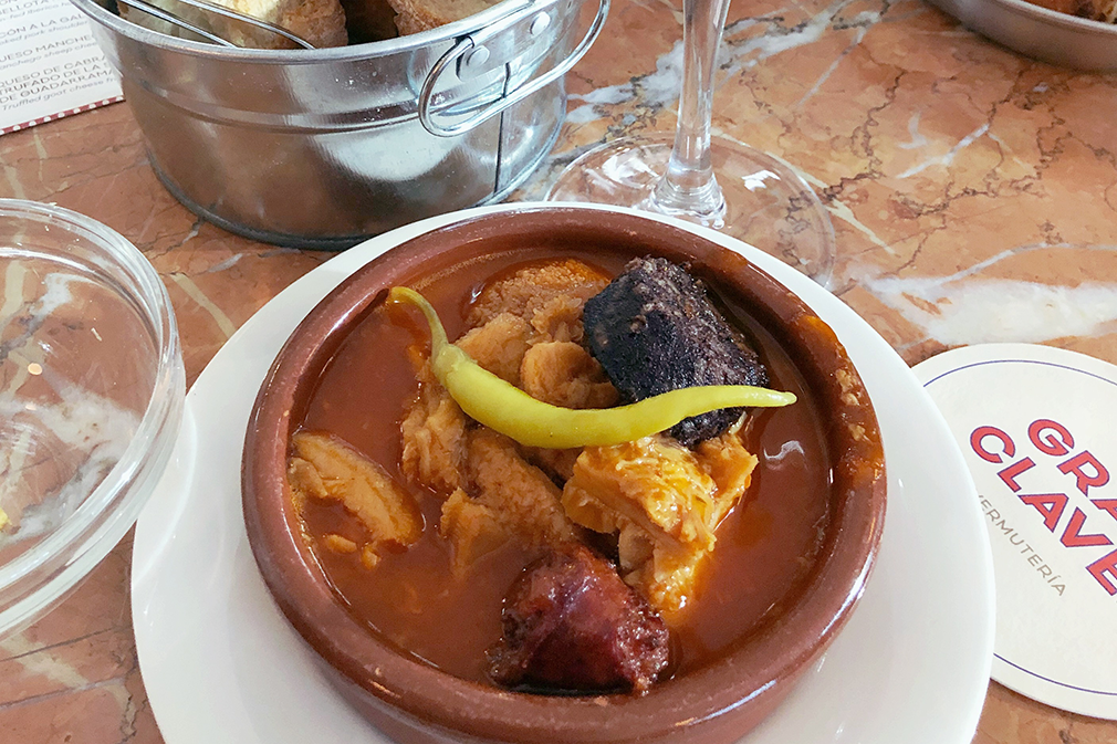 A Spanish dish consisting of tripe, chorizo, and blood sausage