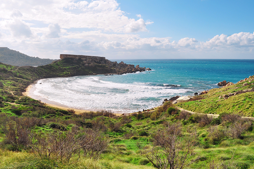 The crescent shaped bay of Għajn Tuffieħa with the il-Qarraba promontory in the distance
