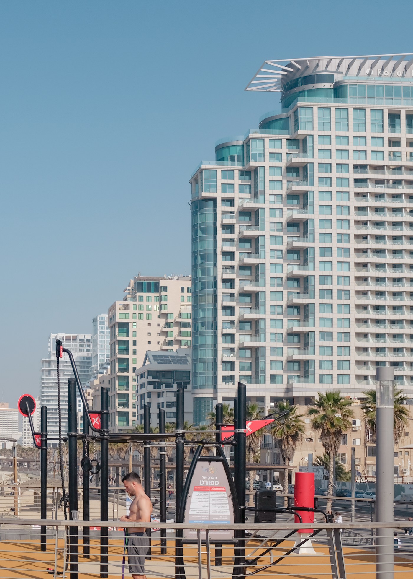 A man working out in a downtown beach area
