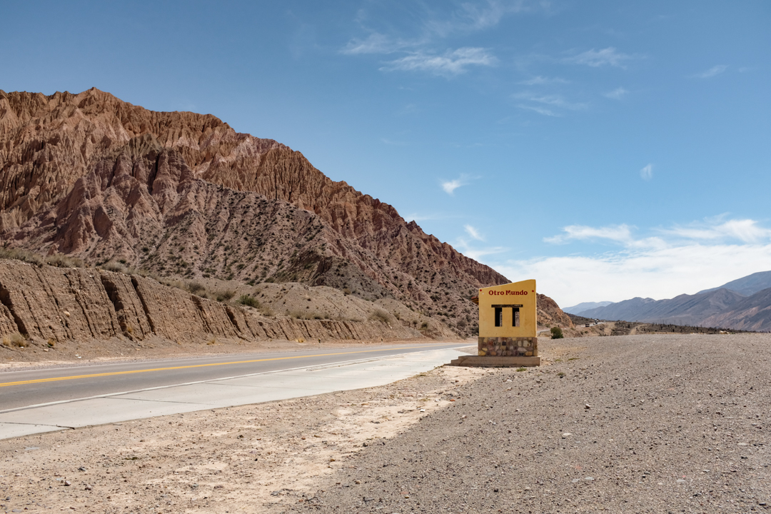 A painted bus stop in a desert landscape