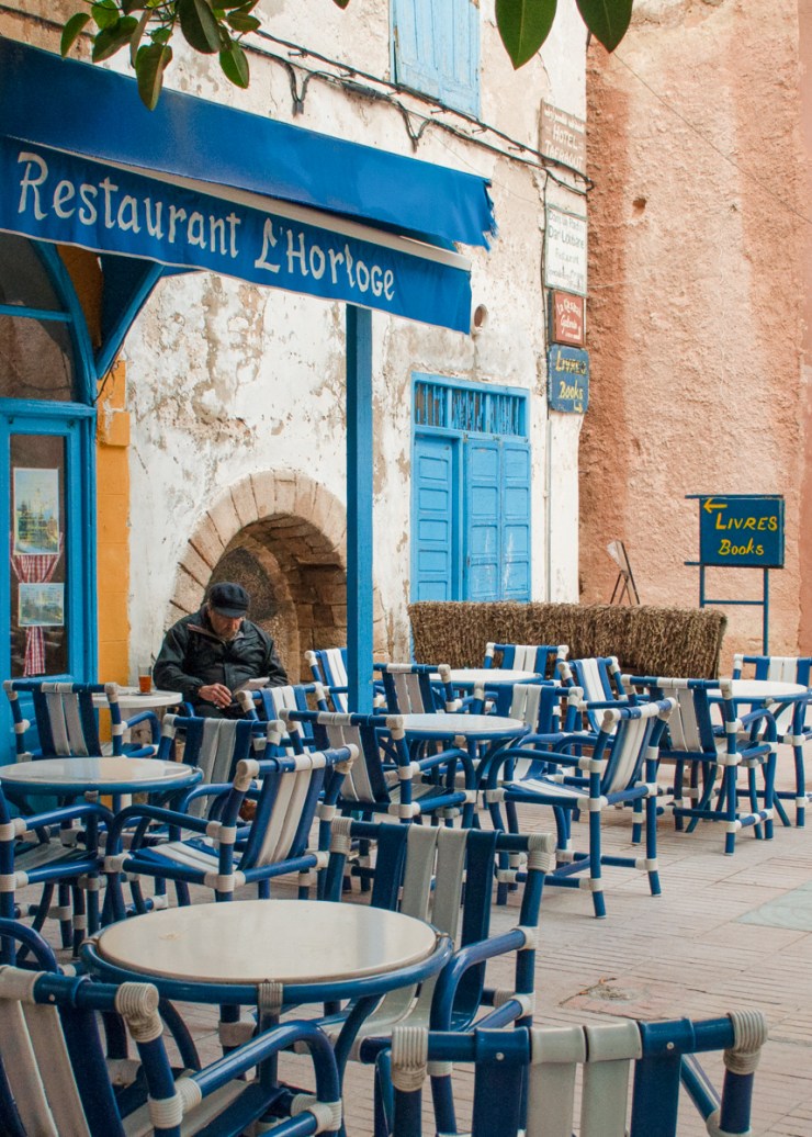 A cafe with blue patio chairs in Essaouïra, Morocco