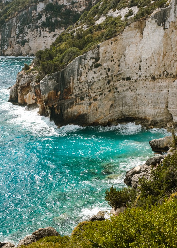 Water splashing against the cliffs along a coastline