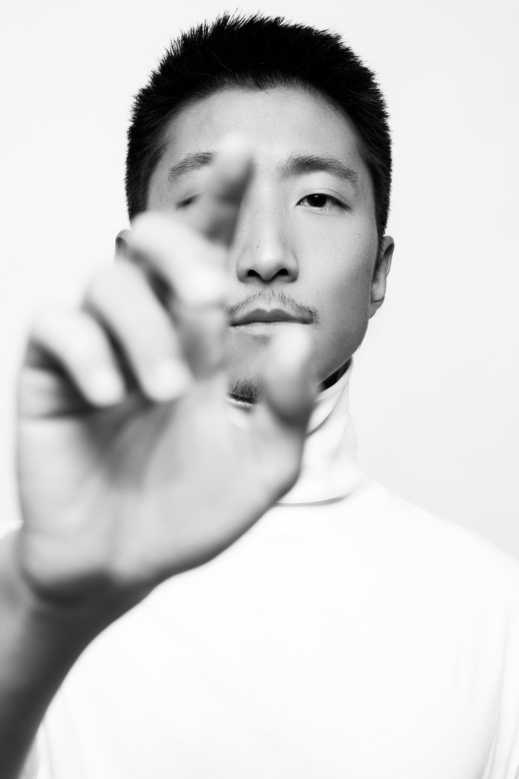 Man with hand raised in air