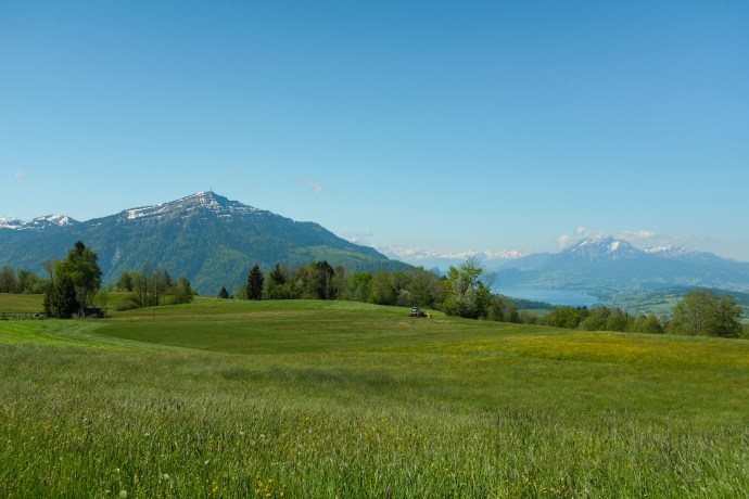 Farmland, lake, and mountains