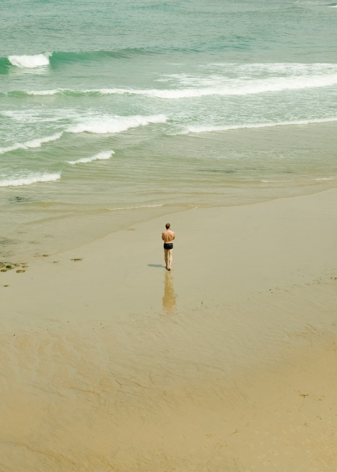 Man walking alone on the beach