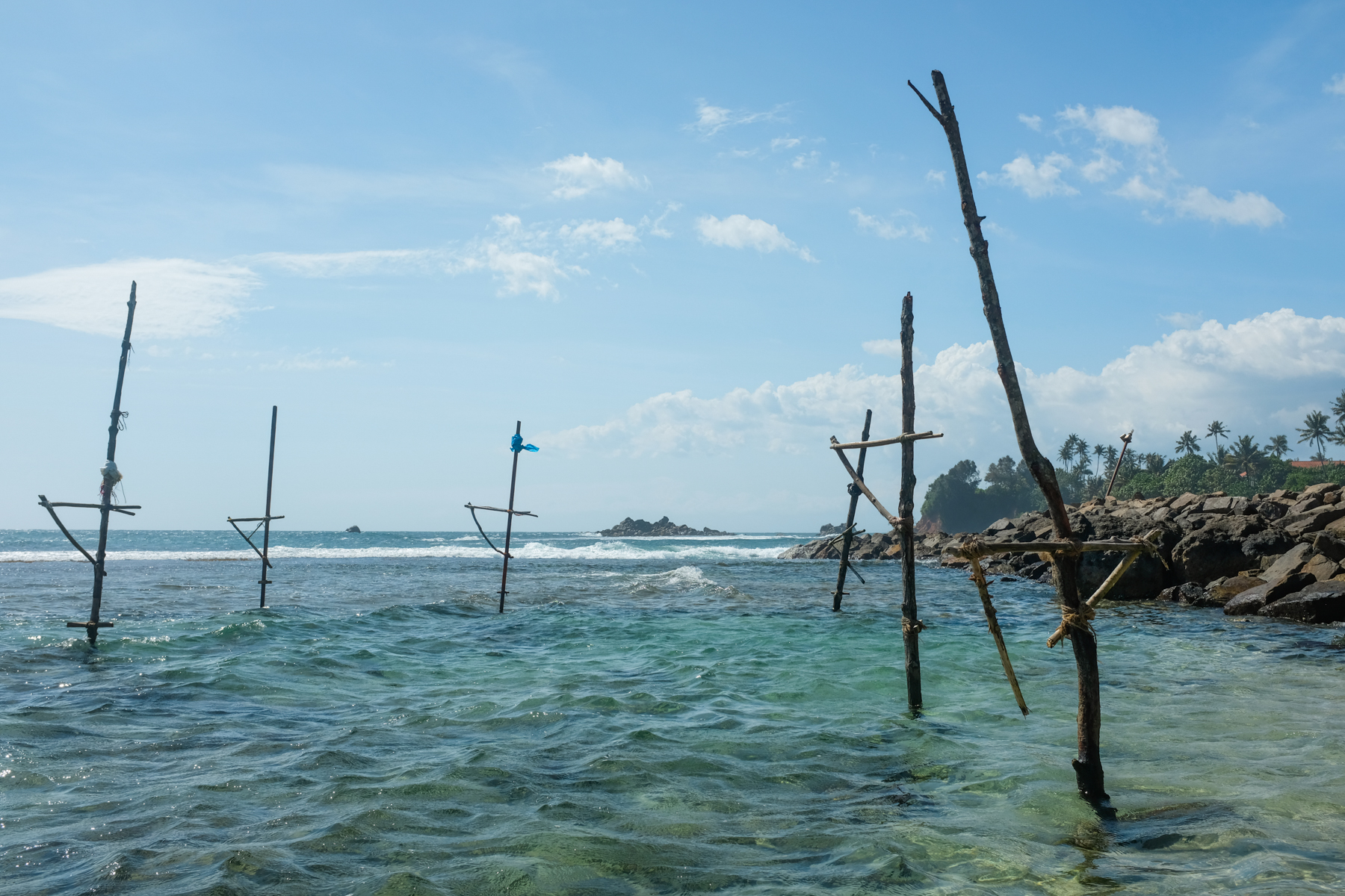 Stilts used by fisherman in a tidal lagoon at high tide